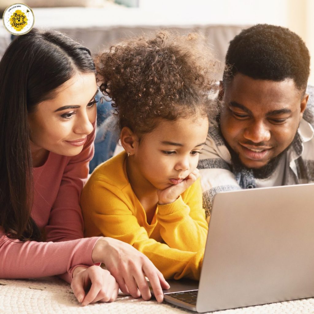 parent coaching with their child on computer