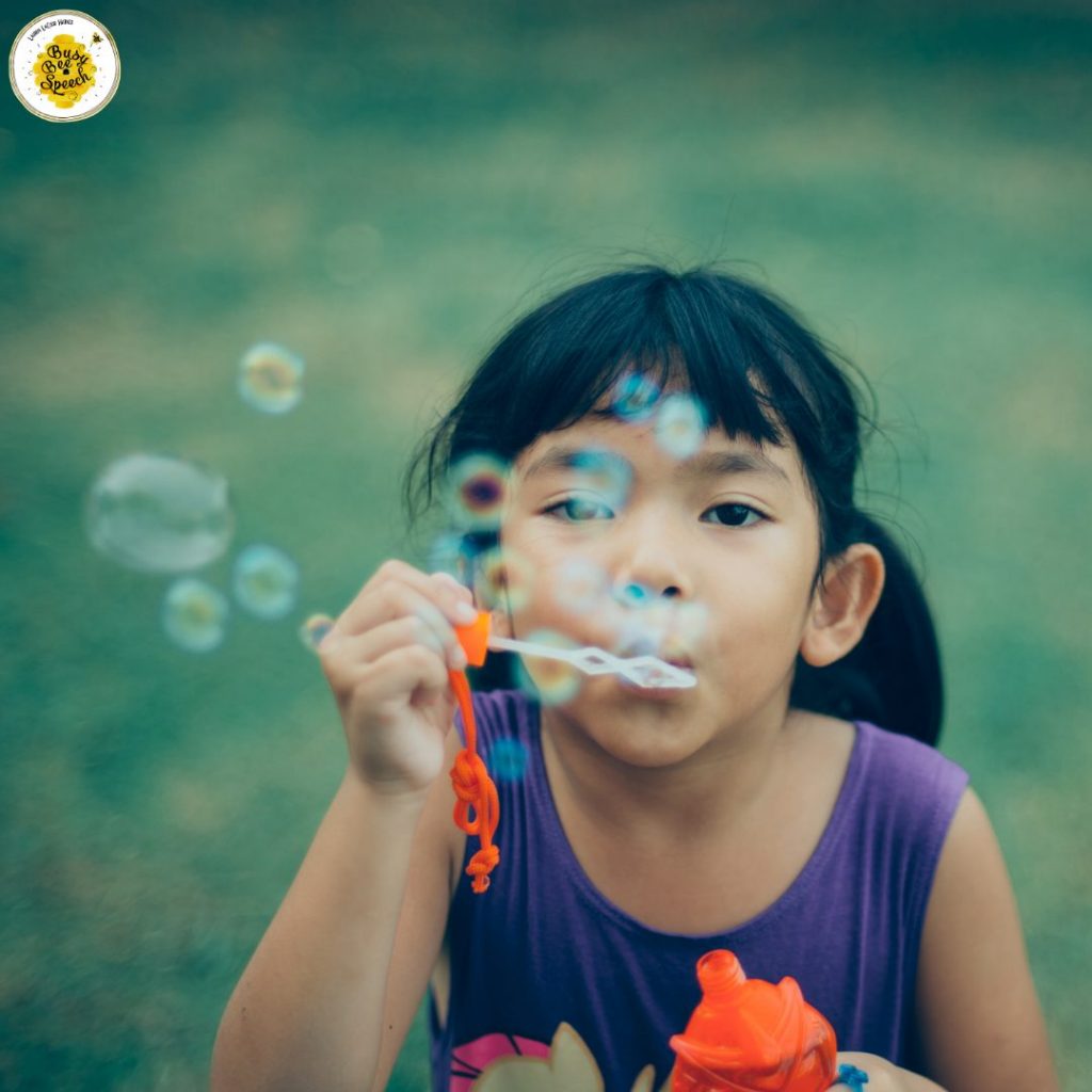 child blowing bubbles - using resources from home