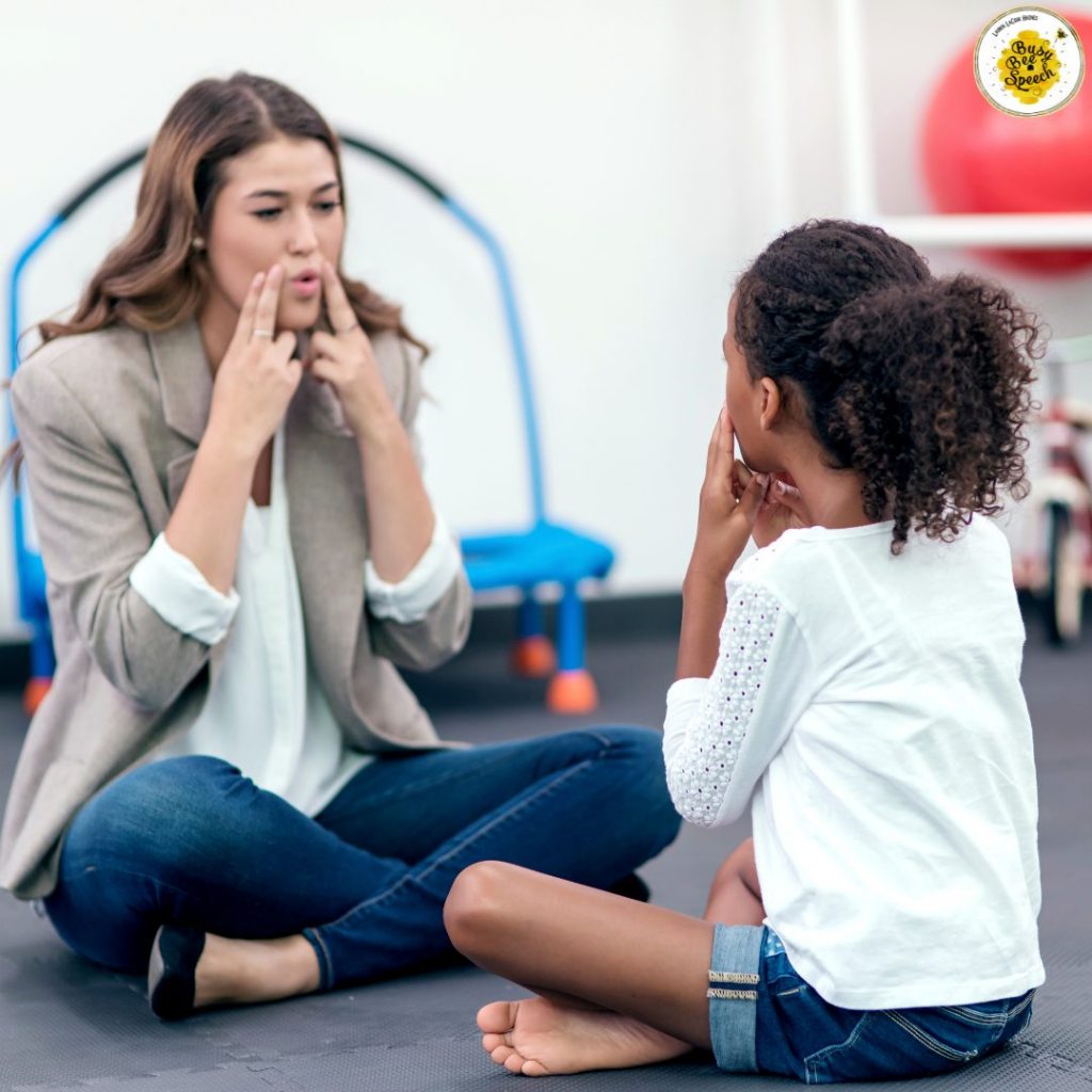 School speech therapist working with a young girl.
